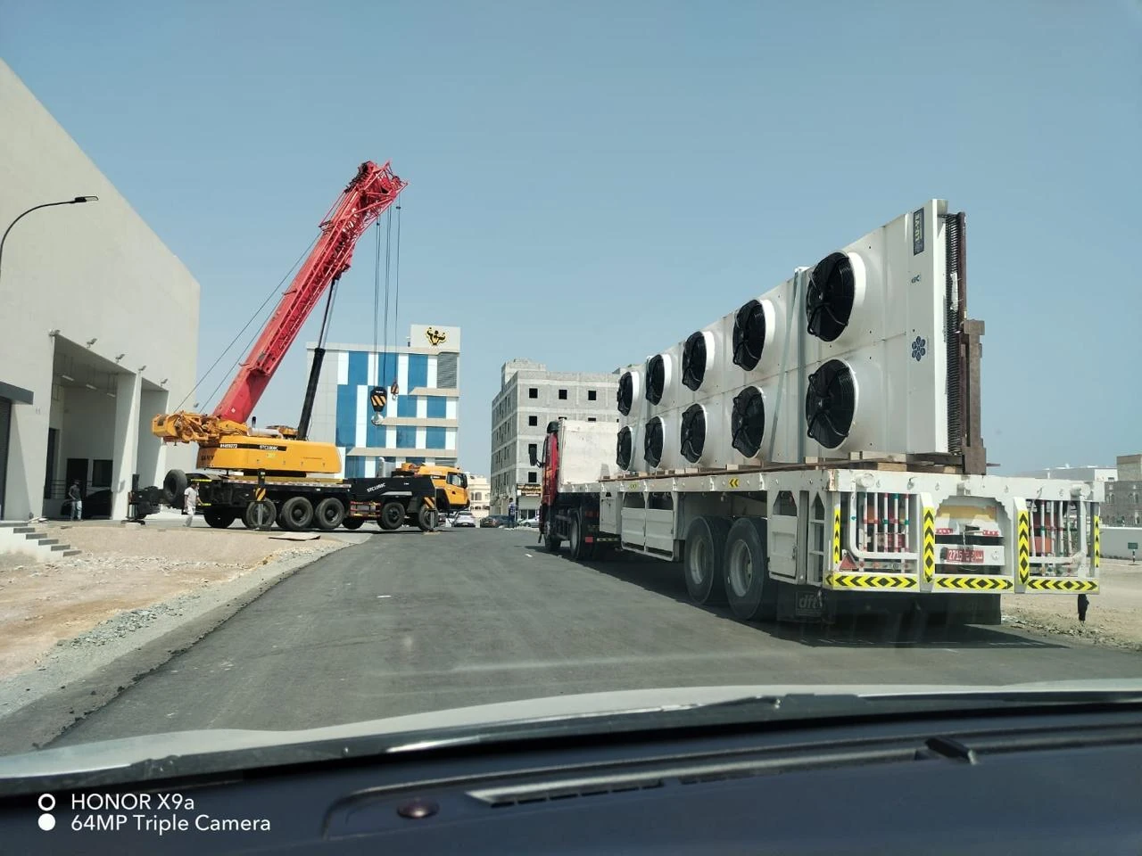 Crane beside a commercial building