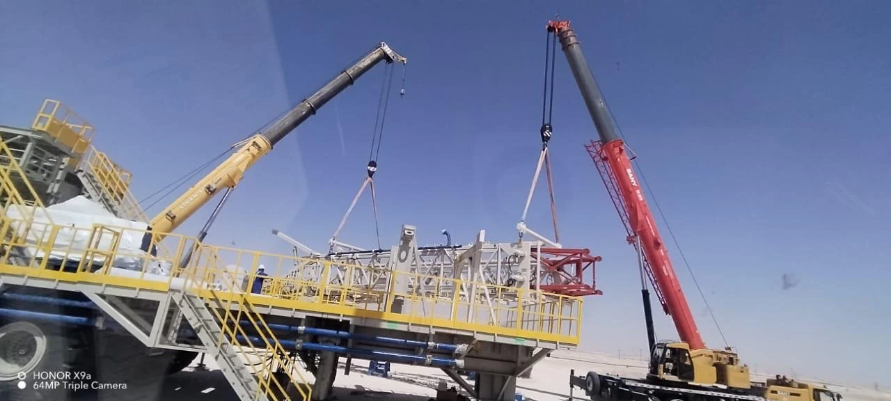 Crane beside industrial structures